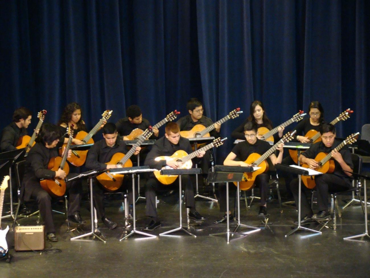 Photo of students playing guitar 