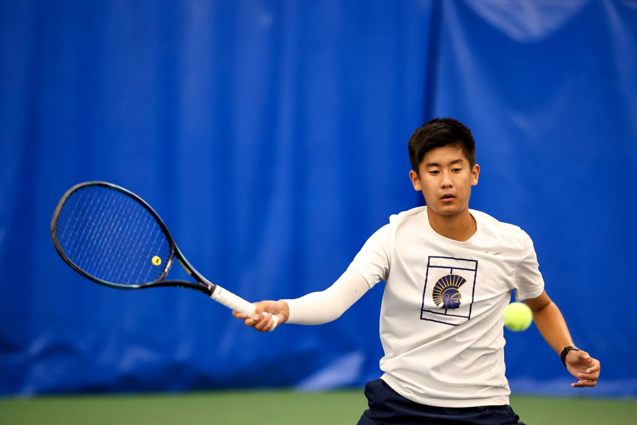 Winston Arvidson hits the tennis ball