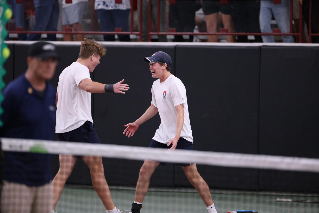 Orono's Anthony Perrill and Quinn Martini celebrate their 2025 Class AA Boys Tennis State Tournament singles doubles championship.