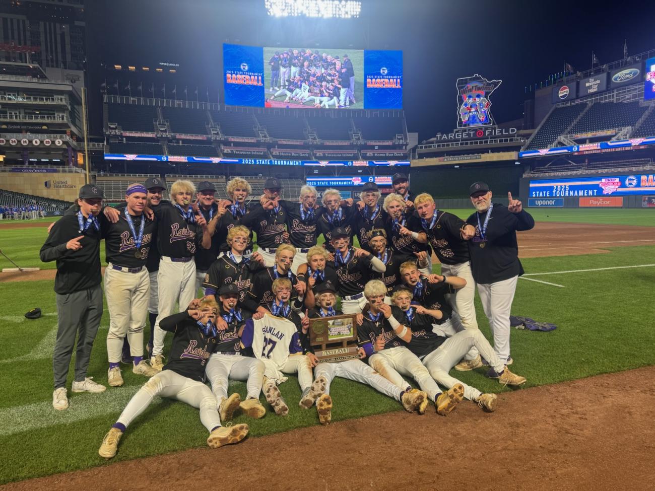 Cretin-Derham Hall baseball team with first-place medals and championship trophy