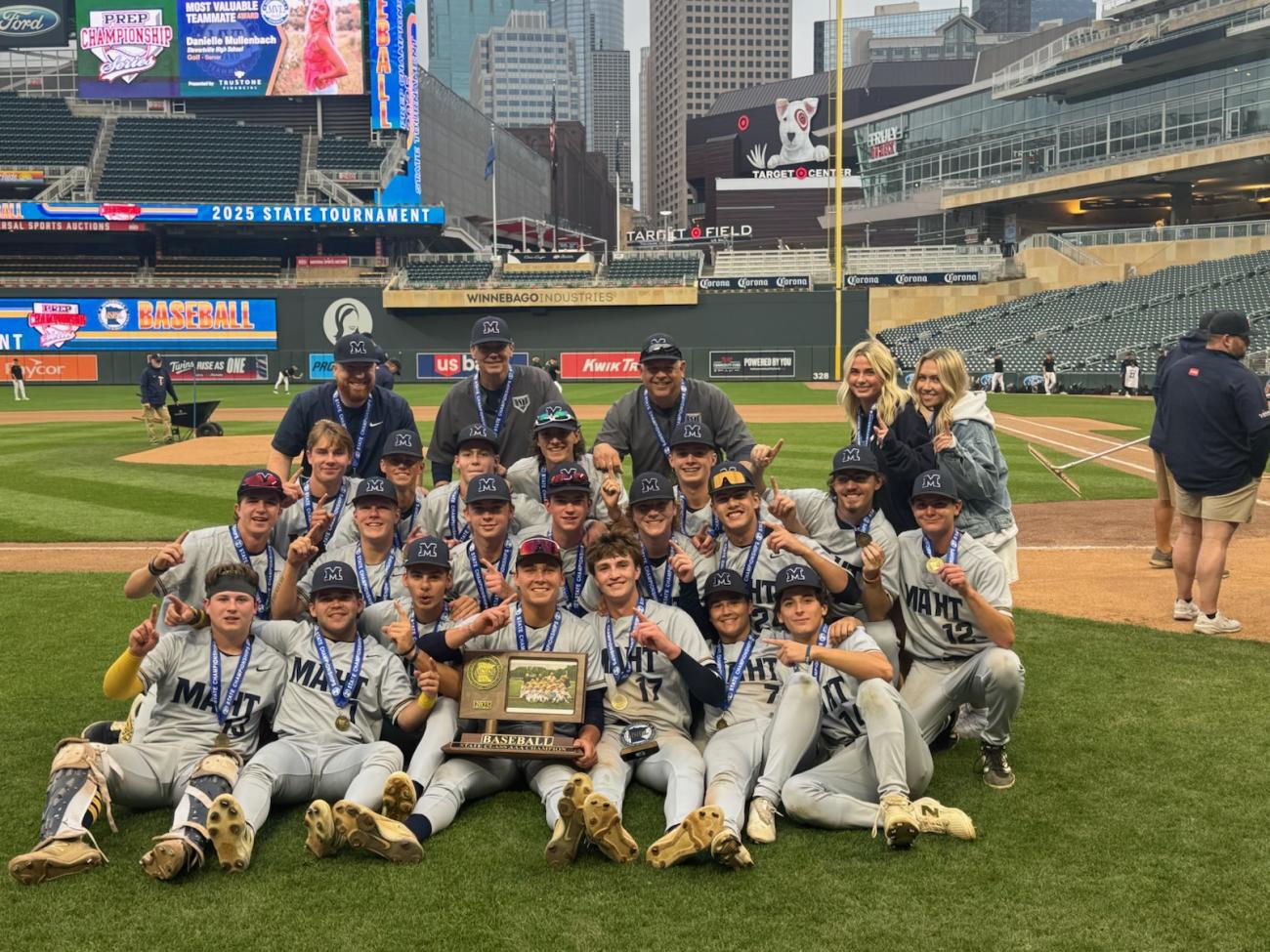 Mahtomedi Baseball team with championship medals and trophy