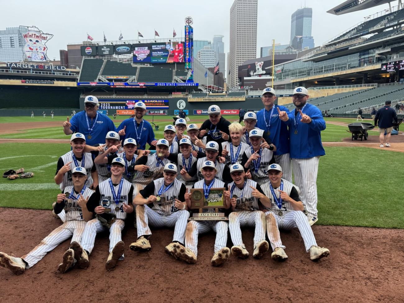 2025 Red Lake County Baseball team with championship trophy at Target Field