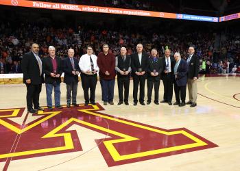 The 2025 Officials Distinguished Service Award winners are honored at Williams Arena.