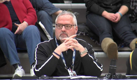 John Millea watching a game in progress from the media table